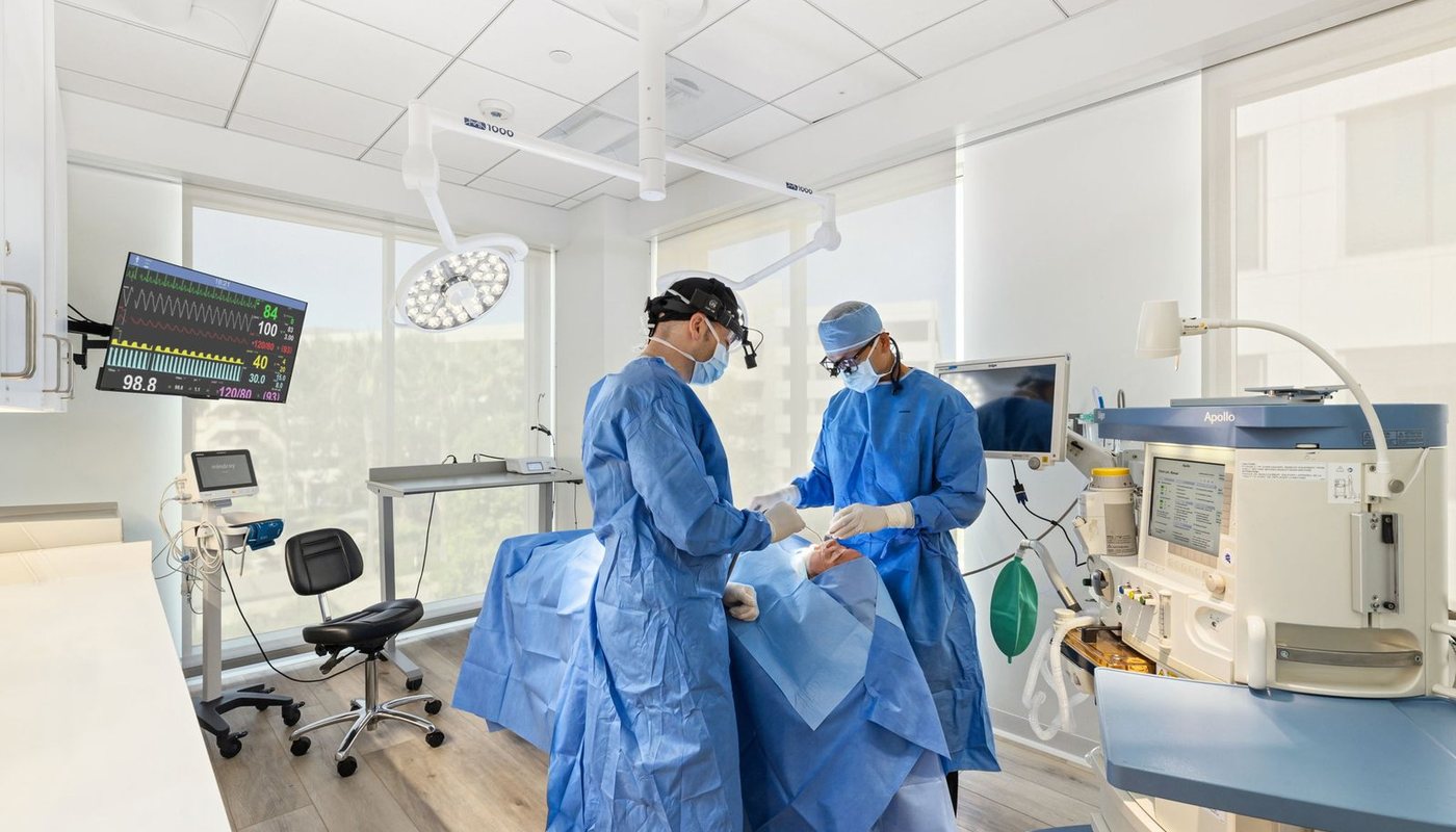 Both surgeons in the operating room at the Irvine office
